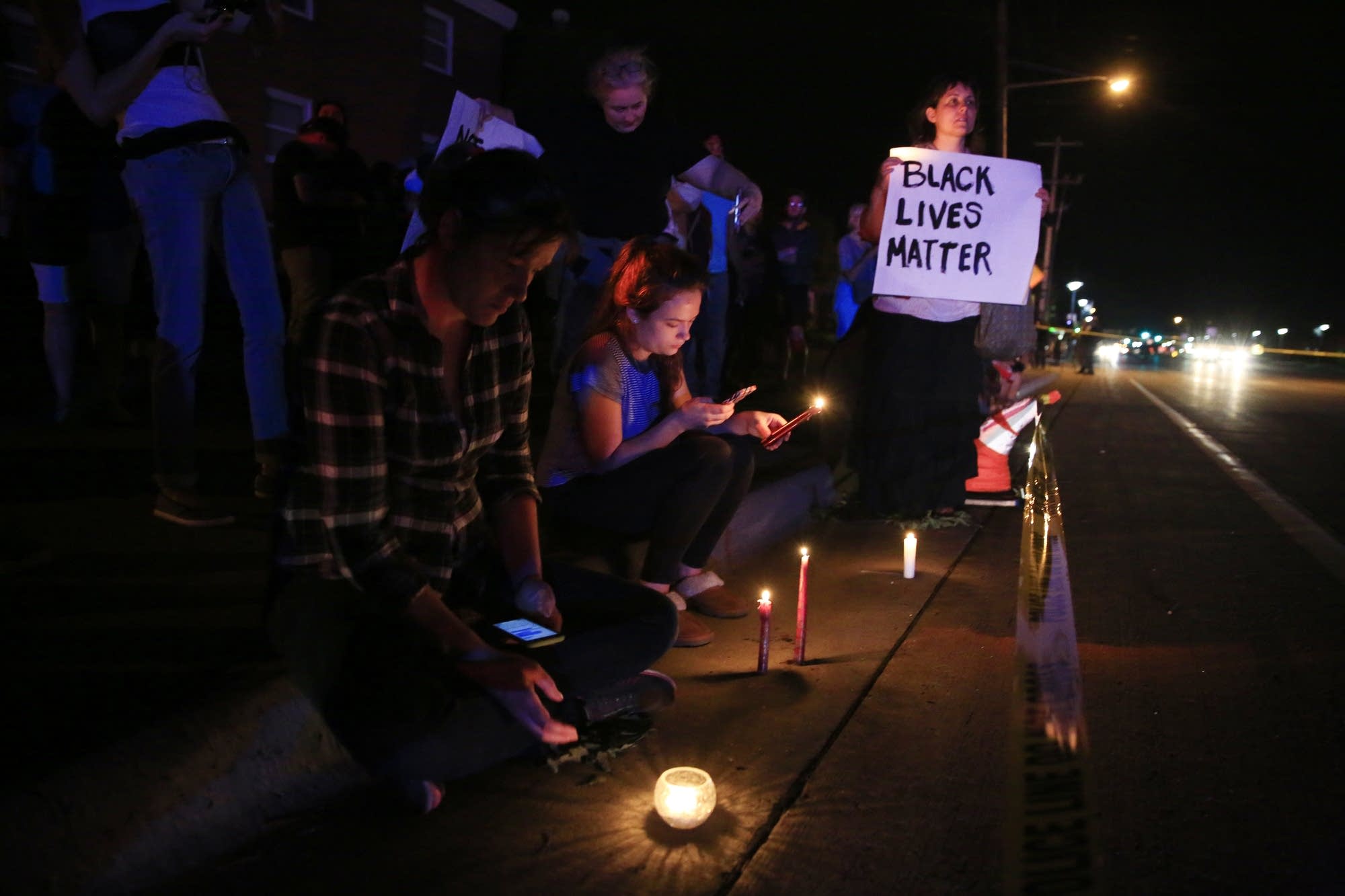 Protesters gather across the street from shooting.