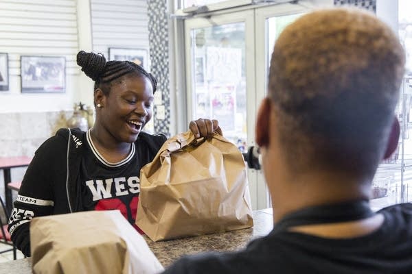 Antiquita Flint picks up lunch to go inside Wendy's House of Soul.