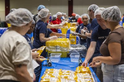 People pack meals