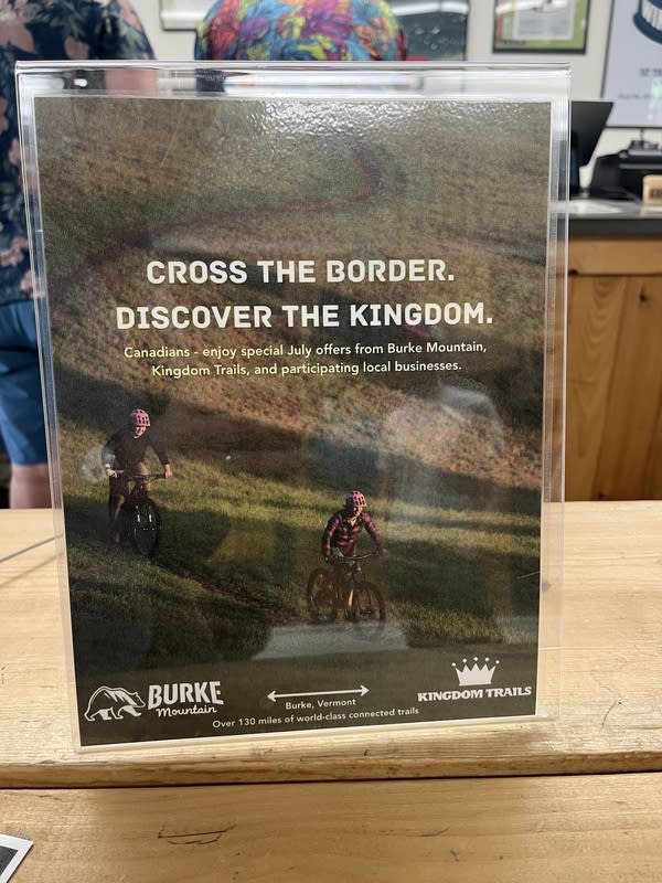 A flyer advertising discounts for Canadians that reads "cross the border. discover the kingdom."