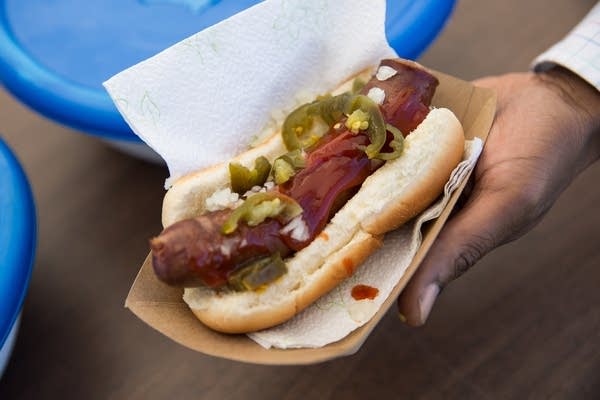 Keynon Starks, one of Faulkner's cousins, shows off a bratwurst.