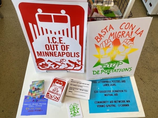 A red sign reads I.C.E. Out of Minneapolis.