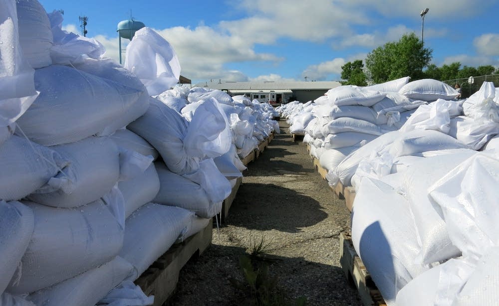 Pallets of sandbags stack up at Kerry Park.