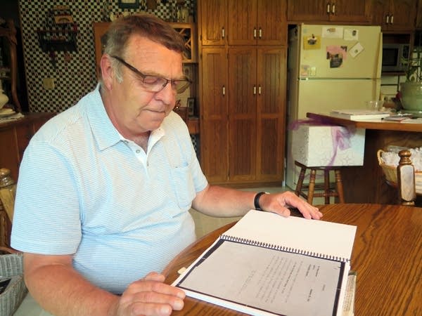 Bob Kerestes looks through information about Elmer Kerestes.