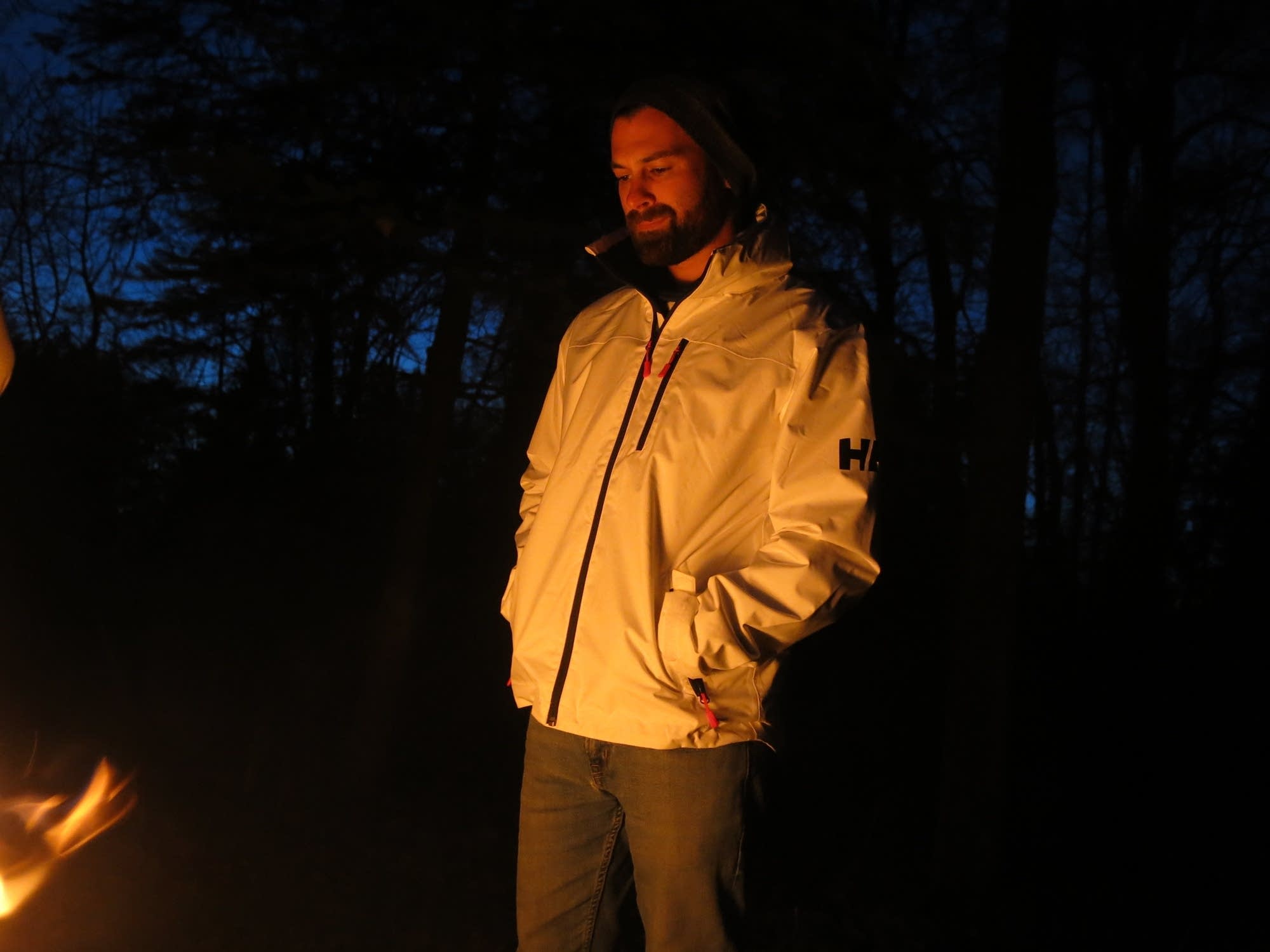 Nate Lastinger stands by the fire in Itasca State Park.