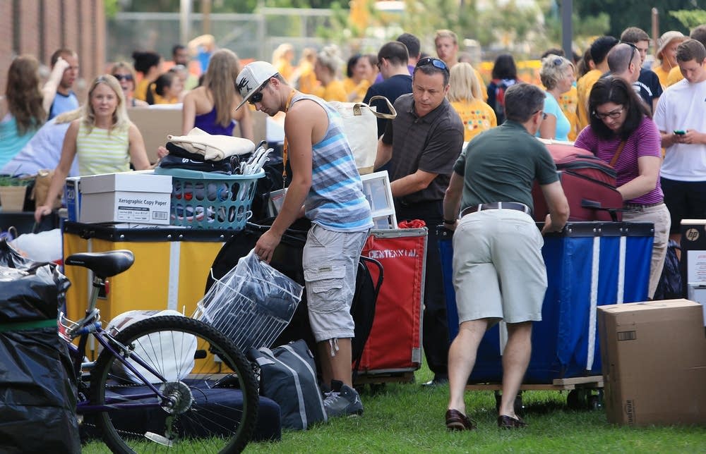 Incoming freshmen and their families pack bins.