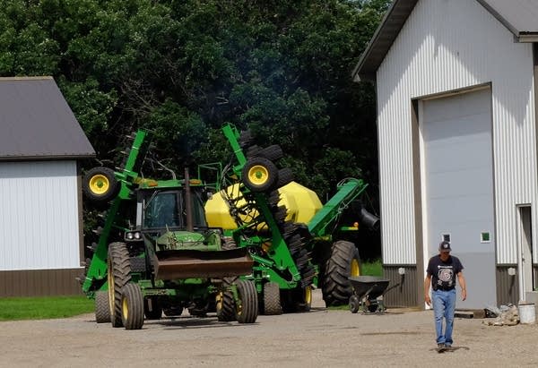 Matt and Larry Ness put spring planting equipment into storage.