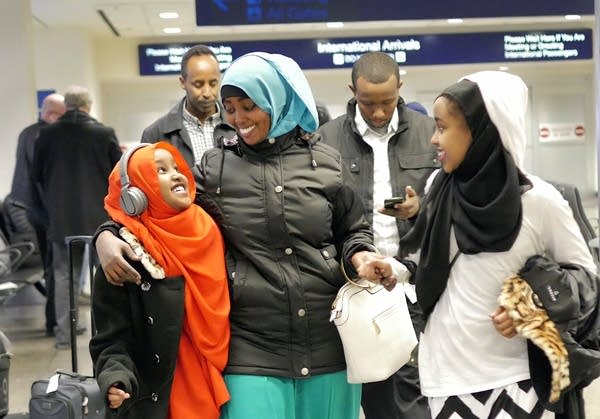 Asiya Iyow and her sister Maryama welcome their aunt, Ayan Abdi.