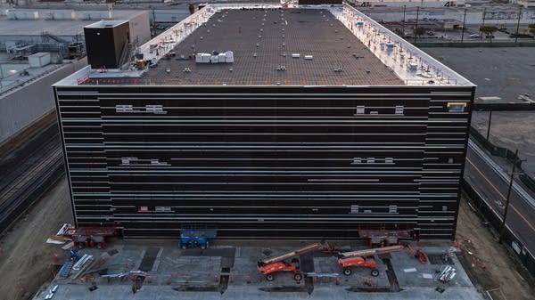Above, an aerial view of a 49.5 megawatt, three-level data center under construction on in Vernon, California, in April.