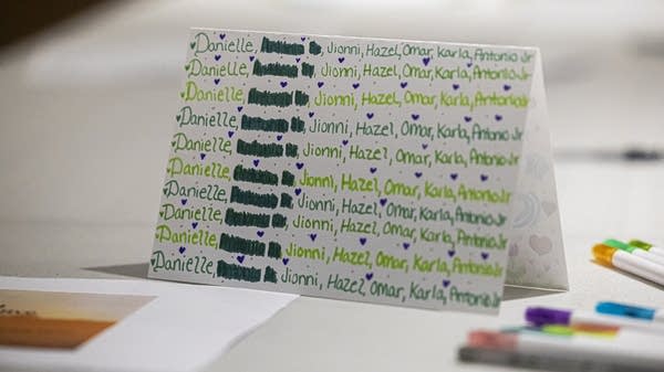 A paper with writings visible.