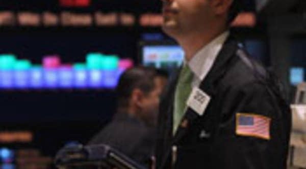 Traders work on the floor of the New York Stock Exchange in New York City.