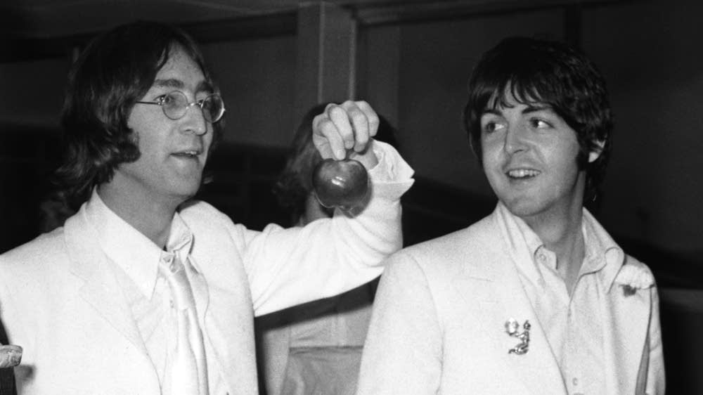 A Beatles White Album, signed and drawn on by John Lennon and Yoko Ono in 1969, is held on display at Christie's Auction House, November 21, 2005 in New York