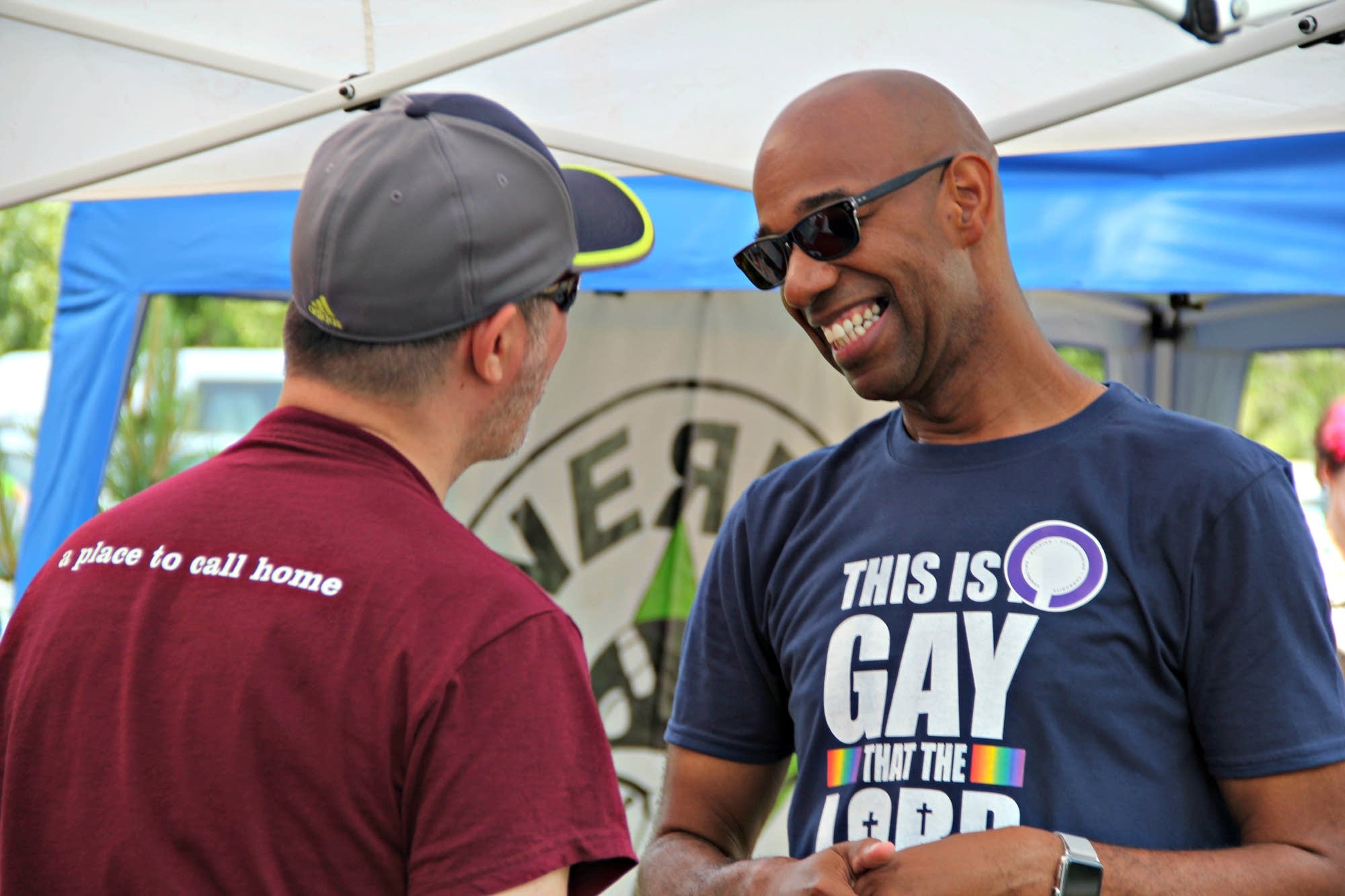 Rev. DeWayne Davis talks with a friend.