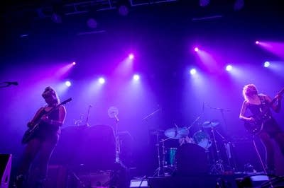 black widows band performing on stage