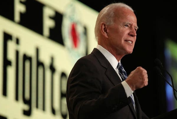 Former Vice president Joe Bide speaks at a conference.