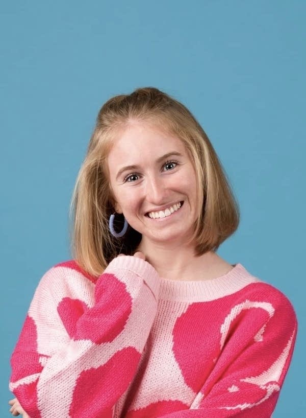 A woman smiles for a photo