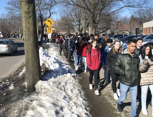 Students walk out of classes in south Minneapolis.