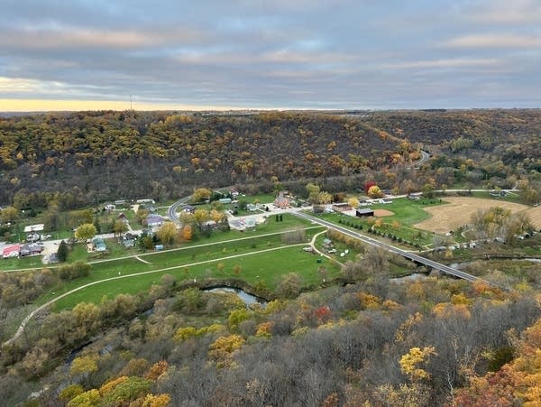 A view from above of a river valley and a small town