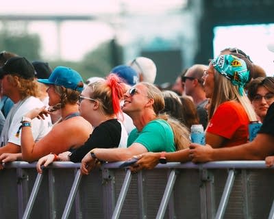 crowd watching the band 311 perform on stage