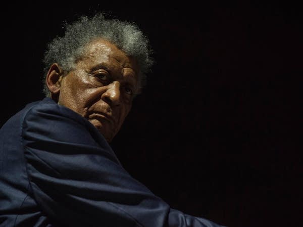 Poster Jazz pianist Abdullah Ibrahim looks over his shoulder at the camera
