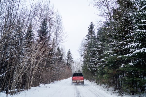 Tamer Ibrahim drives his truck down the miles long drive to his home.