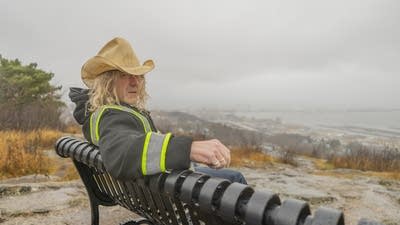 Alan Sparhawk poses for a photo wearing a cowboy hat near Enger Tower in Duluth.