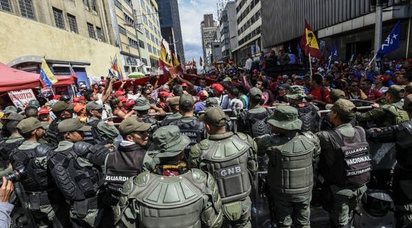 Members of the national guard remain outside the National Assembly during a demo of supporters of Venezuelan President Nicolas Maduro. 