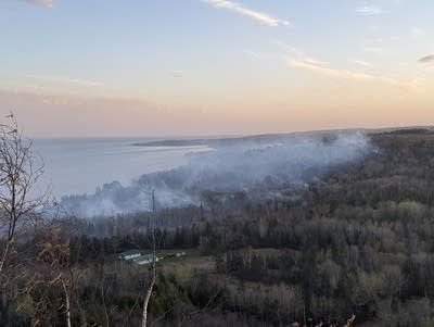 A view of smoke rising from a wildfire