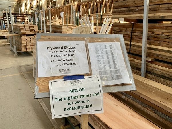 A sign at Second Chance promotes the nonprofit's discounted prices for "experience" wood.