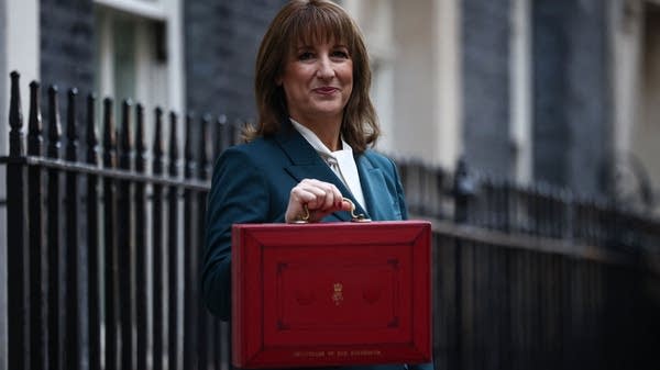 The U.K.'s Finance Minister, Rachel Reeves, poses with the red Budget Box as she leaves 11 Downing Street on Wednesday.