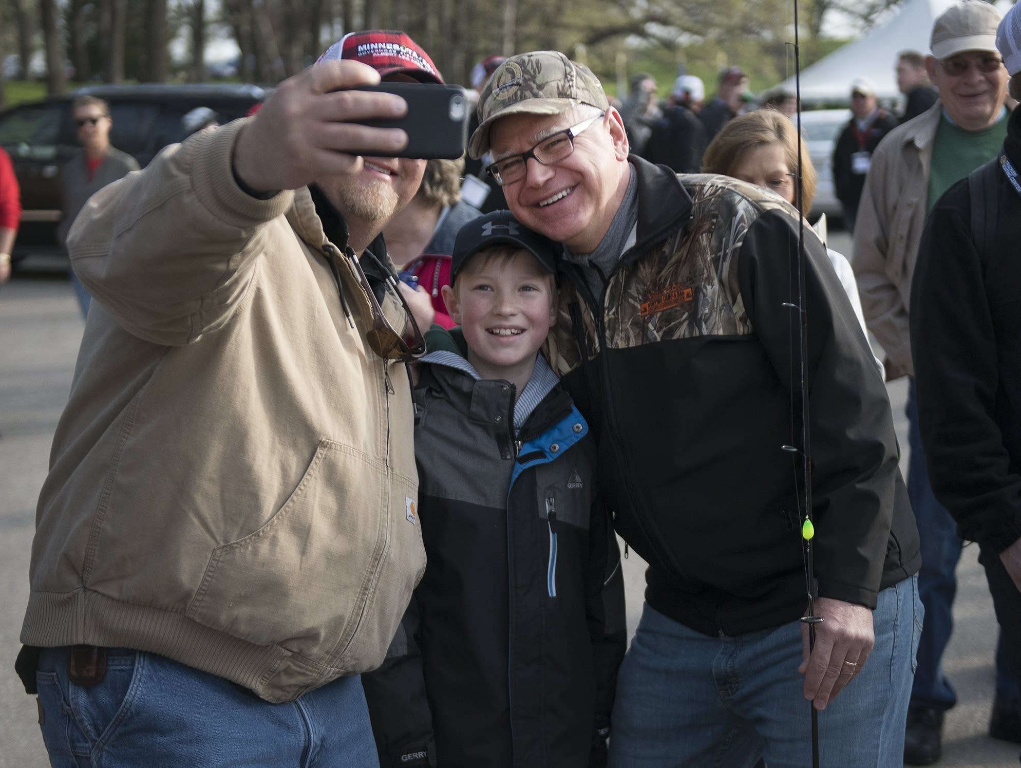 Gov. Tim Walz poses for a picture