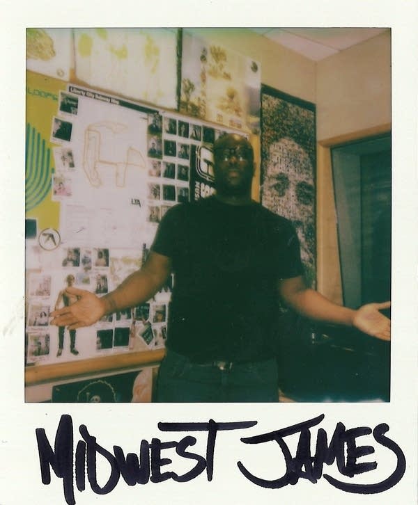 a signed polaroid with a man in it