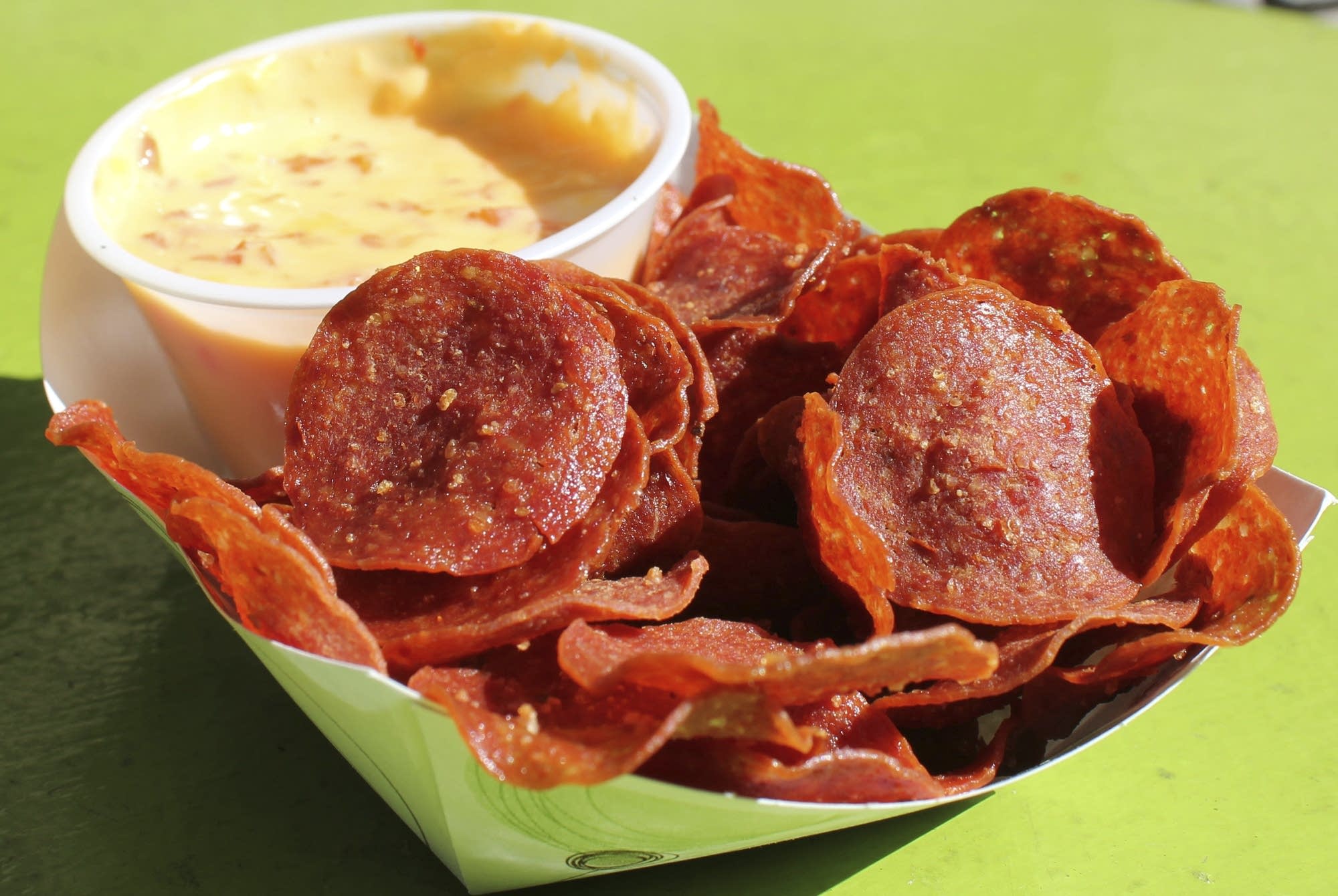 Pepperoni chips with roasted red pepper queso