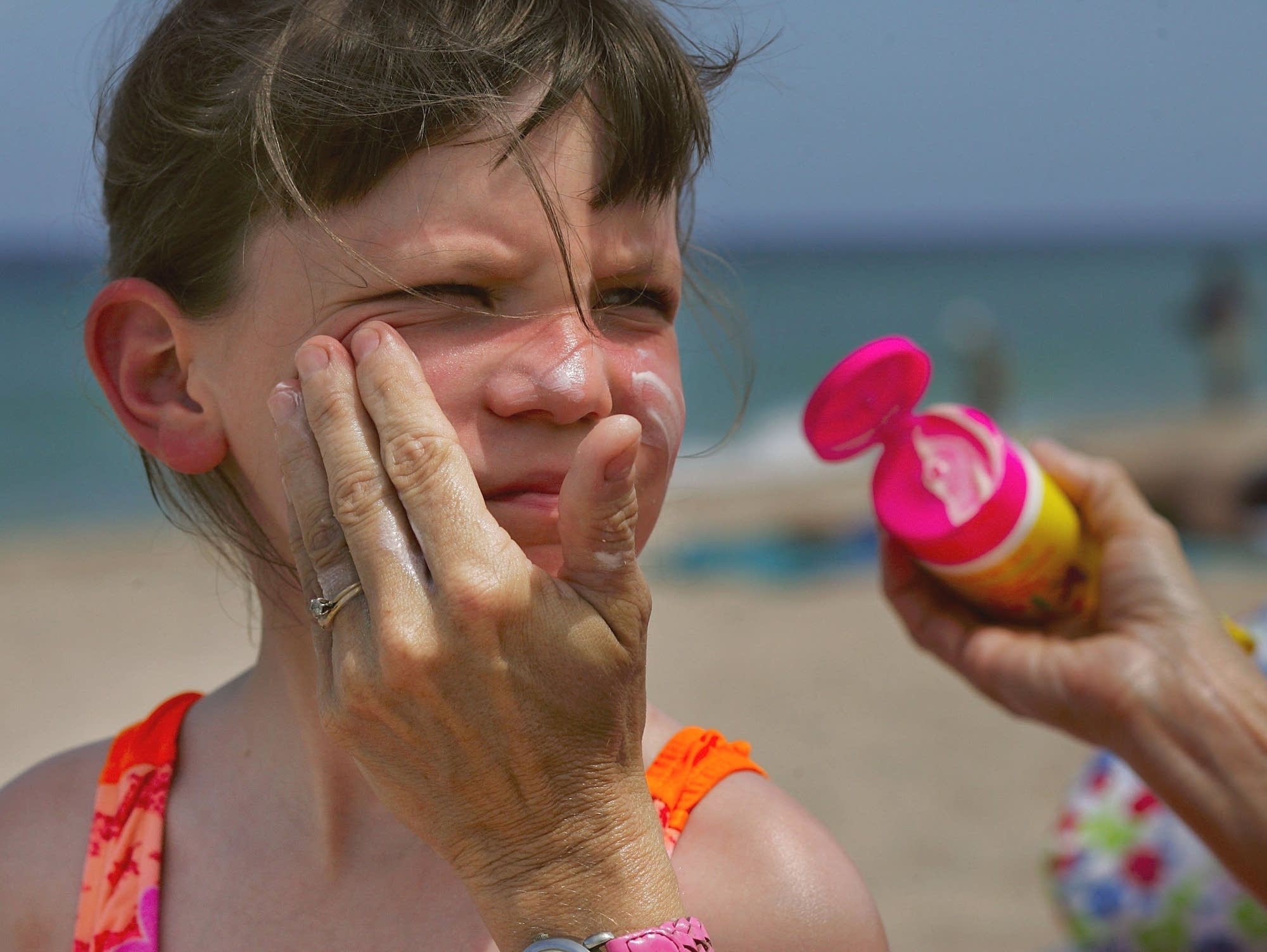 Putting on sunscreen