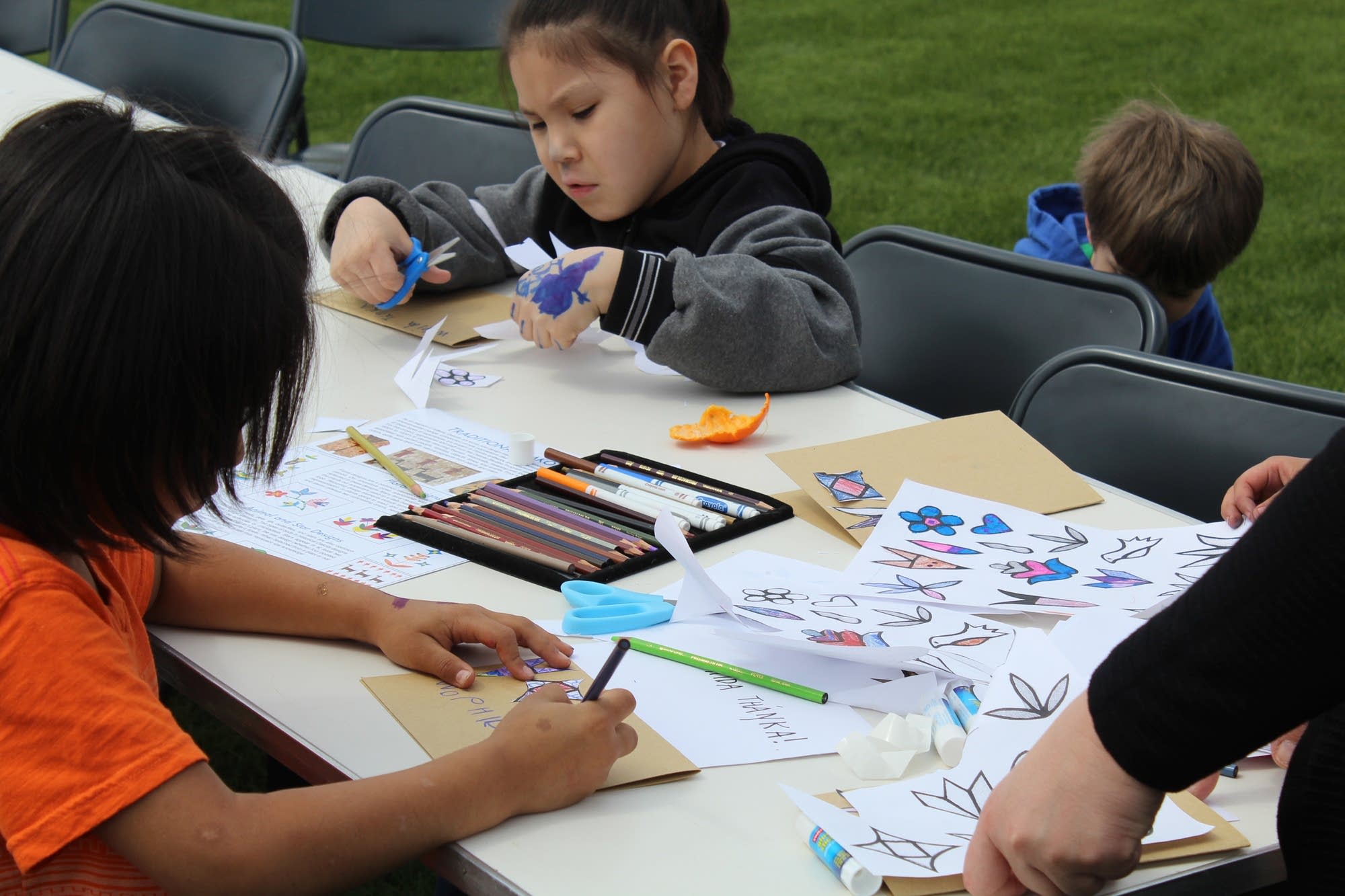 Kids practice a Dakota language exercise at Fort Snelling.