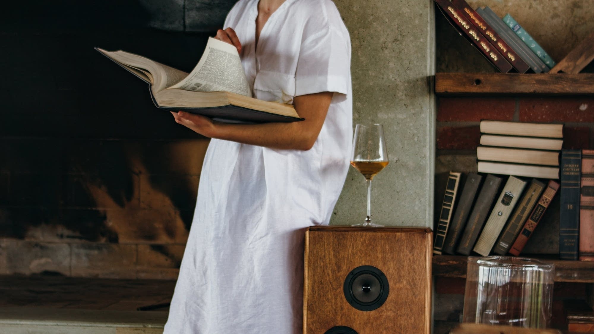 Woman drinking wine and reading