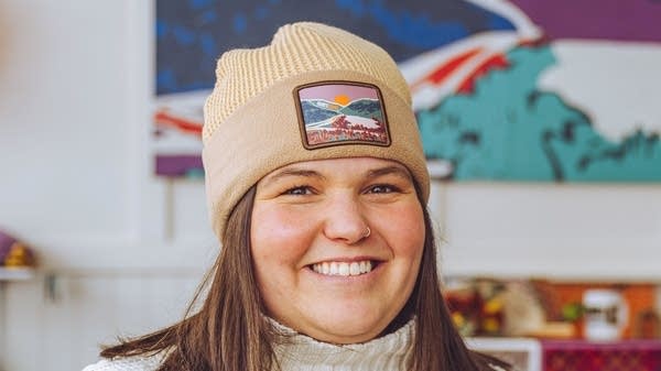 Hailee Grisham Hampton, owner of Hurry Slow Hat Co. in Littleton, New Hampshire, wearing one of her designs. 