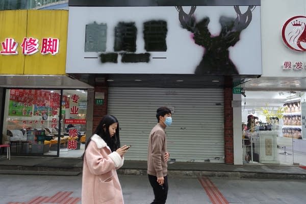 Small shops shuttered in a main shopping area in Shanghai's Fengxian suburbs. 