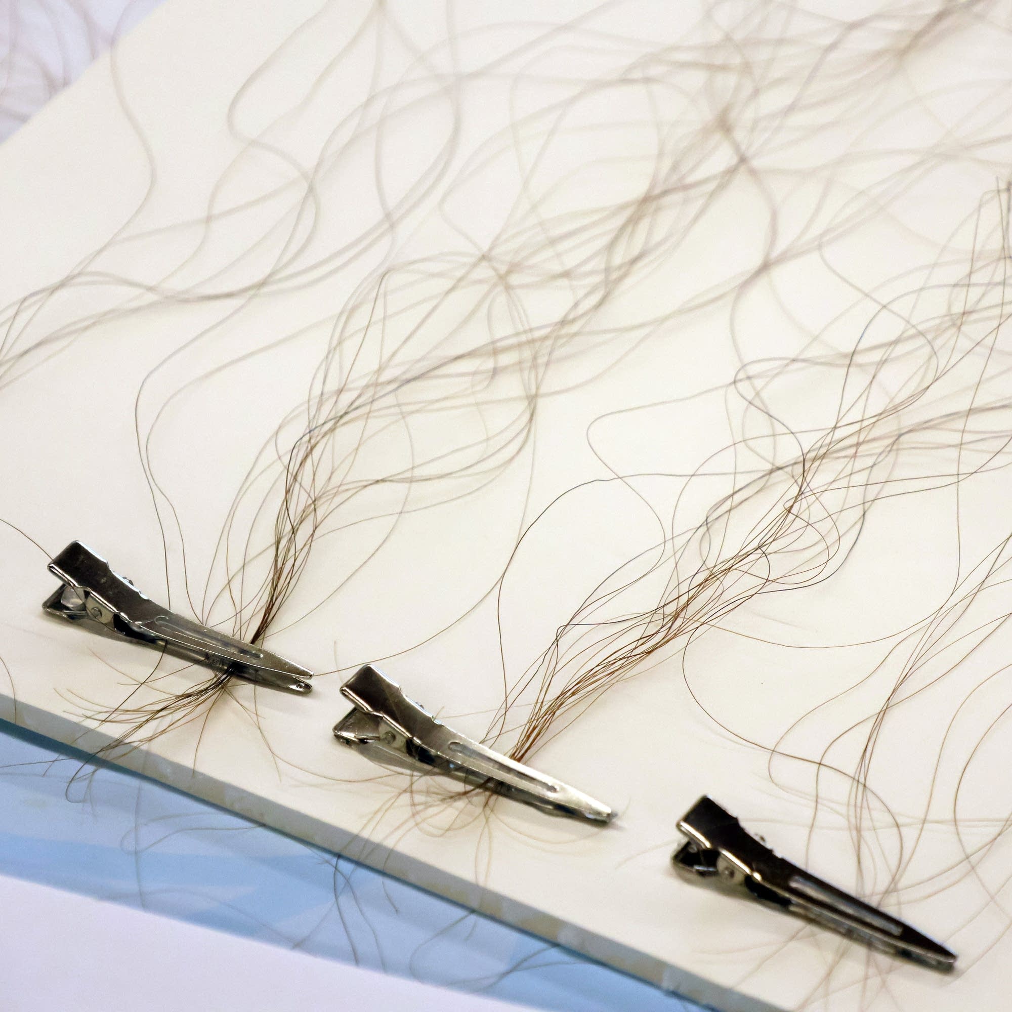 Minnesota artist weaves human hair into wearable art, reviving an