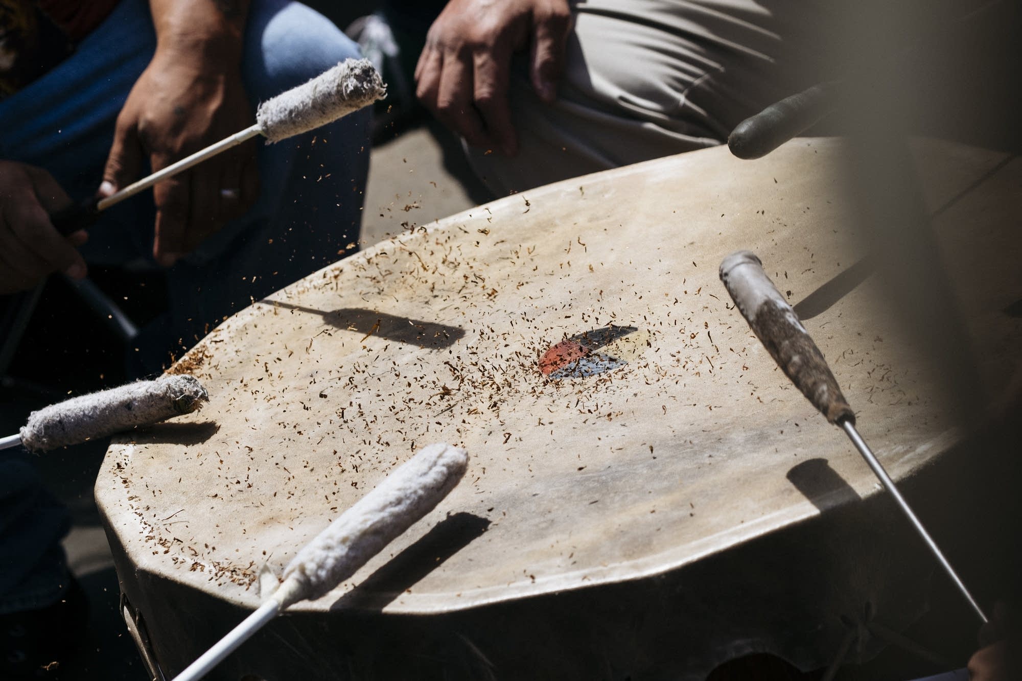 Tobacco bounces off of a drum.