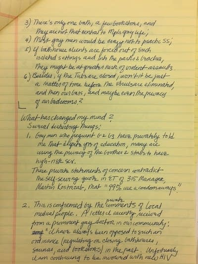 Writing on a yellow note pad