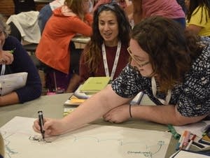 Teachers at a workshop to boost their climate-education skills.