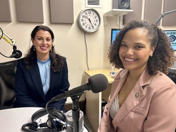 Two women smile for a photo