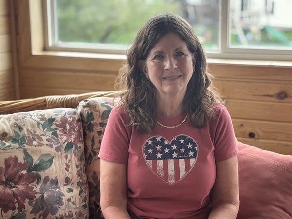 Ann Mikiska sits on her back porch