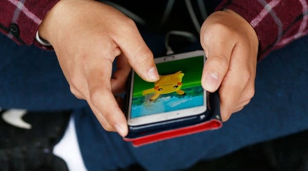 Pokemon Go players meet at a Sydney Opera House. 