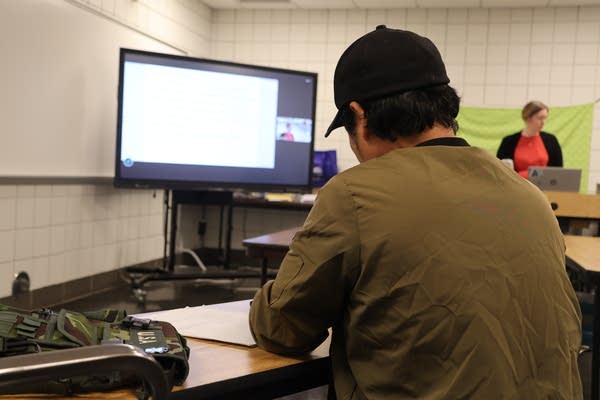A man sitting in a classroom