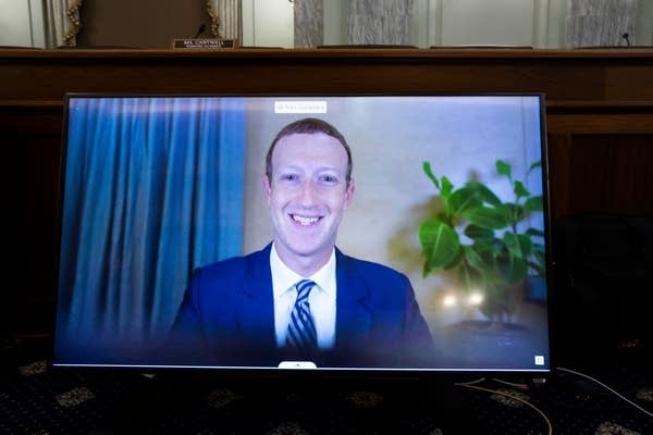 Facebook CEO Mark Zuckerberg appears on a monitor as he testifies remotely during a  hearing to discuss reforming Section 230 of the Communications Decency Act on Oct. 2 in Washington, D.C.