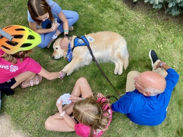 ‘Paws on the Ground’: Comfort dogs help heal at Annunciation Church