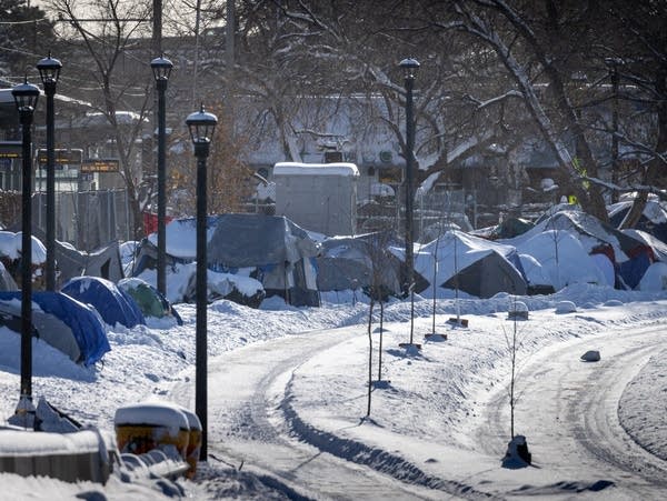 A tent encampment near a light rail station