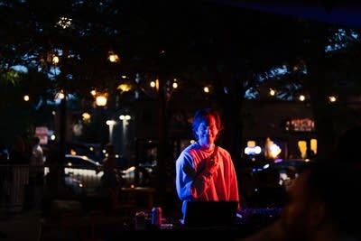 Andre Broder smiling for a photo outdoors